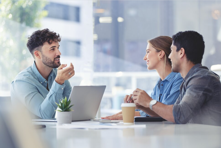 Young couple meeting with a financial advisor | Featured Image for the The Benefits of Working with a Financial Advisor Blog by Horizon Wealth Advisory.